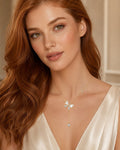 Valenna Collection 18K gold plated butterfly pendant necklace with pavé crystals worn by a woman with red hair.